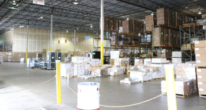 Picture of floor space in a warehouse used to consolidate or breakdown shipping containers